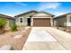 Charming single-story home with a well-manicured front yard and a two-car garage at 32341 N Union St, San Tan Valley, AZ 85143