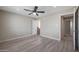 Inviting bedroom with light-colored walls, ceiling fan, and light plank flooring throughout at 3245 N 43Rd N Ave, Phoenix, AZ 85031