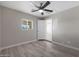 Bright bedroom with wood-look flooring, ceiling fan, and a window providing natural light at 3245 N 43Rd N Ave, Phoenix, AZ 85031