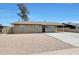 Attractive single-story home with a large driveway and low-maintenance landscaping at 3245 N 43Rd N Ave, Phoenix, AZ 85031