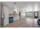 Open concept kitchen with stainless steel appliances that leads into the living room at 3245 N 43Rd N Ave, Phoenix, AZ 85031