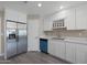 Bright kitchen featuring stainless steel appliances, white cabinets, and a wine rack at 3245 N 43Rd N Ave, Phoenix, AZ 85031