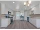 Bright kitchen with white cabinets, stainless steel appliances, and modern lighting at 3245 N 43Rd N Ave, Phoenix, AZ 85031