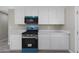 Well-lit kitchen featuring white cabinets and stainless steel appliances at 3245 N 43Rd N Ave, Phoenix, AZ 85031