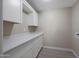 Convenient laundry room with bright cabinets and new countertop at 3245 N 43Rd N Ave, Phoenix, AZ 85031