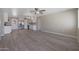 Spacious living room featuring an open concept design with vinyl flooring and a ceiling fan at 3245 N 43Rd N Ave, Phoenix, AZ 85031