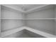 Bright, walk-in pantry offering ample storage with multiple shelves and white painted walls at 3245 N 43Rd N Ave, Phoenix, AZ 85031
