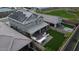 Aerial view of a backyard featuring a built-in outdoor kitchen, patio and lush green turf at 33275 N 132Nd Ave, Peoria, AZ 85383