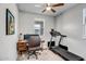 This versatile room features a ceiling fan, a treadmill for fitness, and a compact work space for remote work at 33275 N 132Nd Ave, Peoria, AZ 85383