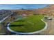 Expansive green space featuring a volleyball court and basketball court near the community playground at 33275 N 132Nd Ave, Peoria, AZ 85383