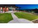 Community space featuring green lawn and a covered outdoor space and seating, perfect for gatherings at 33275 N 132Nd Ave, Peoria, AZ 85383