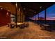 Community space with outdoor seating and a fire pit for gatherings, set against a colorful twilight sky at 33275 N 132Nd Ave, Peoria, AZ 85383