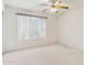 Bright bedroom featuring neutral-toned walls, blinds, and a ceiling fan at 3417 W Abraham Ln, Phoenix, AZ 85027