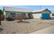 Lovely single-story home with a turquoise garage door and easy-care desert landscaping at 3417 W Abraham Ln, Phoenix, AZ 85027
