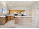 Bright kitchen featuring stainless steel appliances, a functional island, and tile flooring at 3417 W Abraham Ln, Phoenix, AZ 85027