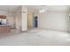 Open-concept living room adjacent to kitchen, showcasing carpet and a stylish interior design at 3417 W Abraham Ln, Phoenix, AZ 85027