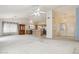 Bright, open-concept living area flows into the kitchen, perfect for modern living and entertaining at 3417 W Abraham Ln, Phoenix, AZ 85027