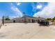 Backyard concrete area with basketball hoop, seating and trailer at 3528 E Decatur St, Mesa, AZ 85213