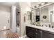 A modern bathroom with a large shower and and sinks at 3528 E Decatur St, Mesa, AZ 85213