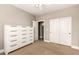 Bedroom with a large dresser and a closet at 3528 E Decatur St, Mesa, AZ 85213