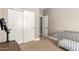 Neutral bedroom with a crib and closet at 3528 E Decatur St, Mesa, AZ 85213