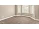 A carpeted room with lots of natural light at 3528 E Decatur St, Mesa, AZ 85213