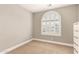 Bedroom with a arched window and neutral carpet at 3528 E Decatur St, Mesa, AZ 85213