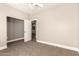 Bedroom with neutral carpet, white trim and ceiling fan at 3528 E Decatur St, Mesa, AZ 85213