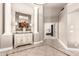 Inviting foyer featuring neutral walls, tiled floors, and decorative mirror above a stylish accent table at 3528 E Decatur St, Mesa, AZ 85213