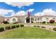 Stunning single-story home featuring a well-manicured lawn, elegant architecture, and a circular driveway at 3528 E Decatur St, Mesa, AZ 85213