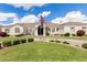 Stunning single-story home featuring a well-manicured lawn, elegant architecture, and a circular driveway at 3528 E Decatur St, Mesa, AZ 85213