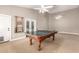 A spacious game room featuring a classic ping pong table and ample space for recreation and entertainment at 3528 E Decatur St, Mesa, AZ 85213