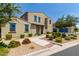 Charming two-story home featuring a neutral-toned facade, manicured landscaping, and a welcoming entryway at 3855 S Mcqueen Rd # 24, Chandler, AZ 85286