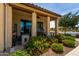 Beautifully landscaped patio with colorful flowers, and charming architecture with tan columns at 3855 S Mcqueen Rd # 24, Chandler, AZ 85286