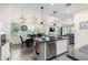 Bright, open-concept kitchen with granite island, stainless appliances, and seamless flow into the living area at 3855 S Mcqueen Rd # 24, Chandler, AZ 85286