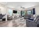 Cozy living room with plush seating, modern entertainment center, and natural light from large windows at 3855 S Mcqueen Rd # 24, Chandler, AZ 85286