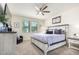 Serene main bedroom with a king-size bed, plush bedding, and ample natural light from windows at 3855 S Mcqueen Rd # 24, Chandler, AZ 85286