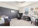 Bright home office with a gray accent wall, desk, office chairs, and large window at 3855 S Mcqueen Rd # 24, Chandler, AZ 85286
