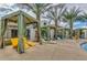 Resort-style pool area with cabanas, lounge chairs, and lush palm trees for a relaxing escape at 3855 S Mcqueen Rd # 24, Chandler, AZ 85286