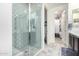 Modern bathroom shower with tiled walls and a glass door, next to stylish flooring and walk-in closet at 3855 S Mcqueen Rd # 24, Chandler, AZ 85286