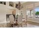 Bright dining area with a rustic chandelier, stylish decor, and ample natural light at 4055 N Recker Rd # 82, Mesa, AZ 85215