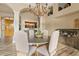 Elegant dining room with a rustic chandelier, stylish decor, and ample seating at 4055 N Recker Rd # 82, Mesa, AZ 85215