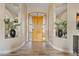 Bright foyer featuring a decorative front door, wood flooring, and stylish interior design at 4055 N Recker Rd # 82, Mesa, AZ 85215