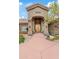 Inviting front entrance with a decorative wooden door, stone accents, and lush landscaping at 4055 N Recker Rd # 82, Mesa, AZ 85215
