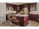 Elegant kitchen featuring stainless steel appliances, granite countertops, and a center island with seating at 4055 N Recker Rd # 82, Mesa, AZ 85215