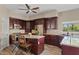Stylish kitchen featuring granite countertops, stainless steel appliances, and cherry wood cabinets at 4055 N Recker Rd # 82, Mesa, AZ 85215