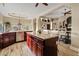 Open kitchen with an island, granite countertops, stainless steel appliances, and ample cabinet space at 4055 N Recker Rd # 82, Mesa, AZ 85215