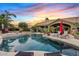 Backyard pool with mature landscaping, lounge seating and a covered patio with seating at 4055 N Recker Rd # 82, Mesa, AZ 85215