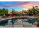 Stunning pool with desert landscaping offering a tranquil retreat, ideal for enjoying the warm Arizona evenings at 4055 N Recker Rd # 82, Mesa, AZ 85215