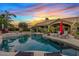 Backyard pool with mature landscaping, basketball hoop, lounge seating and a covered patio at 4055 N Recker Rd # 82, Mesa, AZ 85215